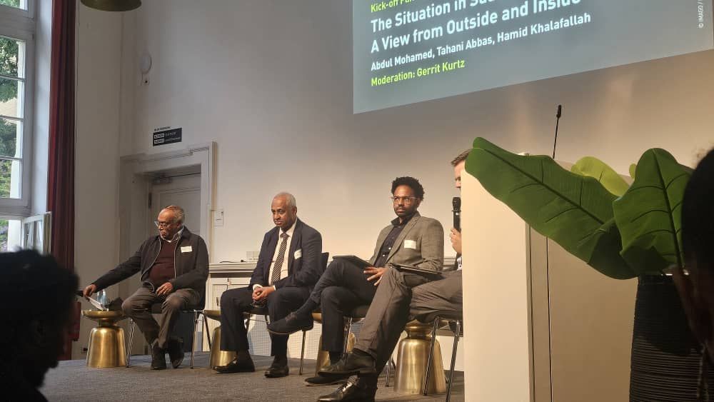 Hamid Khalafallah speaking at a panel